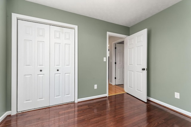 829 Navajo Trl, Mcminnville, TN 37110 - unfurnished bedroom featuring baseboards, wood finished floors, and a closet