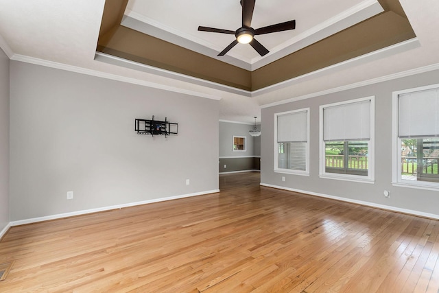 829 Navajo Trl, Mcminnville, TN 37110 - unfurnished room with a raised ceiling, hardwood / wood-style floors, ceiling fan, baseboards, and crown molding