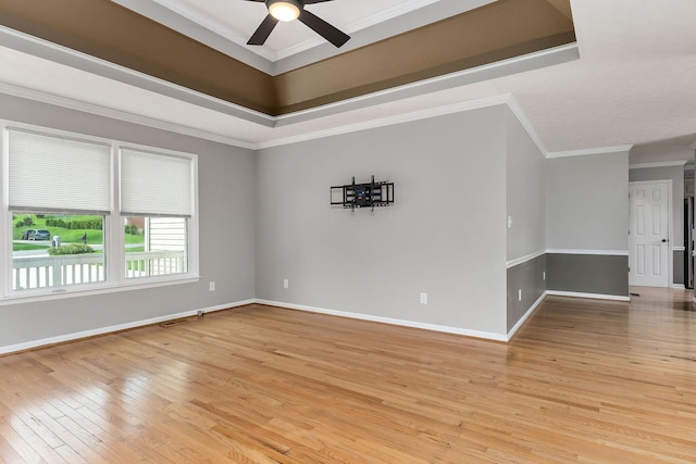 829 Navajo Trl, Mcminnville, TN 37110 - unfurnished room with light wood-style floors, a ceiling fan, baseboards, and crown molding