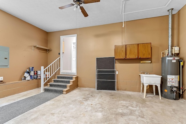 829 Navajo Trl, Mcminnville, TN 37110 - garage featuring gas water heater, a ceiling fan, and electric panel