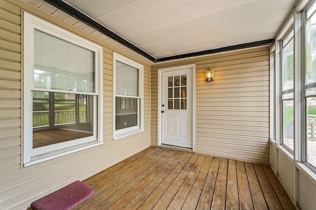 829 Navajo Trl, Mcminnville, TN 37110 - unfurnished sunroom featuring wooden walls and hardwood / wood-style flooring