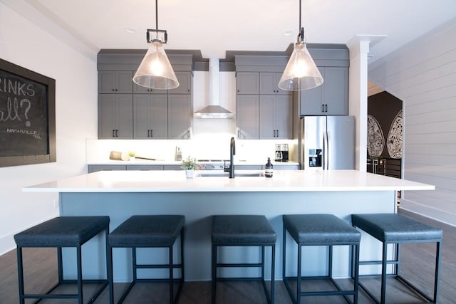 1106 Greenwood Ave, Nashville, TN 37206 - kitchen featuring stainless steel refrigerator with ice dispenser, wall chimney exhaust hood, a sink, light countertops, and gray cabinetry