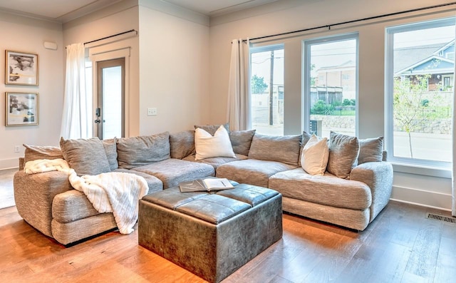 1106 Greenwood Ave, Nashville, TN 37206 - living room with light wood finished floors, healthy amount of natural light, and ornamental molding