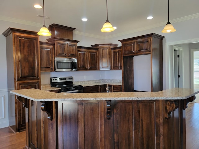 5502 Reflection Rd, Smyrna, TN 37167 - kitchen featuring stainless steel microwave, range with electric cooktop, dark brown cabinetry, wood finished floors, and crown molding