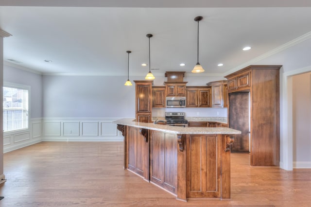 5502 Reflection Rd, Smyrna, TN 37167 - kitchen featuring stainless steel appliances, light stone counters, a kitchen bar, light wood-style floors, and crown molding