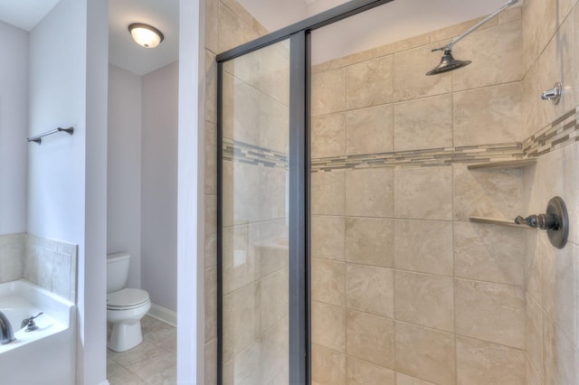 5502 Reflection Rd, Smyrna, TN 37167 - bathroom featuring toilet, a bath, a stall shower, and tile patterned floors