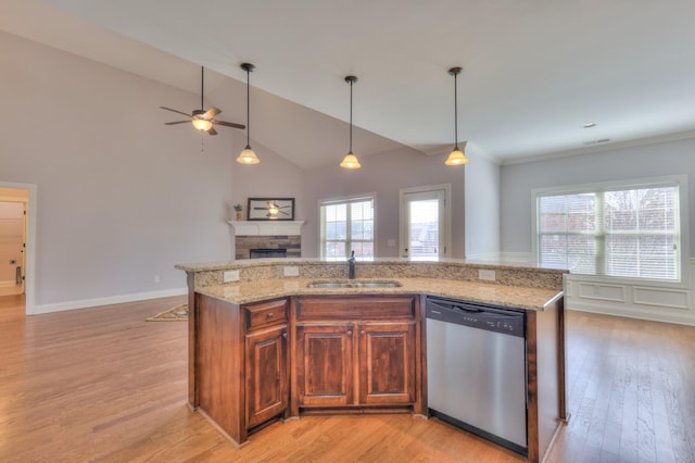 5502 Reflection Rd, Smyrna, TN 37167 - kitchen with dishwasher, a sink, a fireplace, open floor plan, and healthy amount of natural light