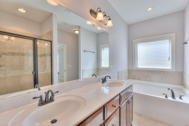 5502 Reflection Rd, Smyrna, TN 37167 - bathroom with a bath, double vanity, a stall shower, tile patterned flooring, and recessed lighting