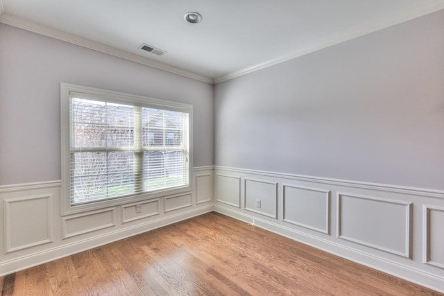 5502 Reflection Rd, Smyrna, TN 37167 - unfurnished room featuring plenty of natural light, wainscoting, light wood-style floors, and ornamental molding