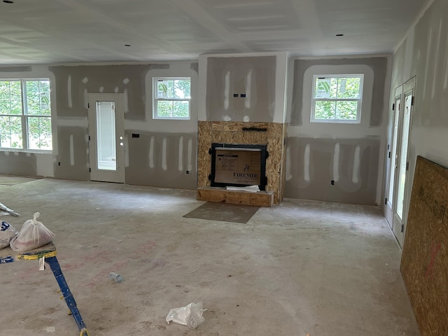 112 Stoneybrook Rd N, Columbia, TN 38401 - unfurnished living room featuring plenty of natural light and a stone fireplace