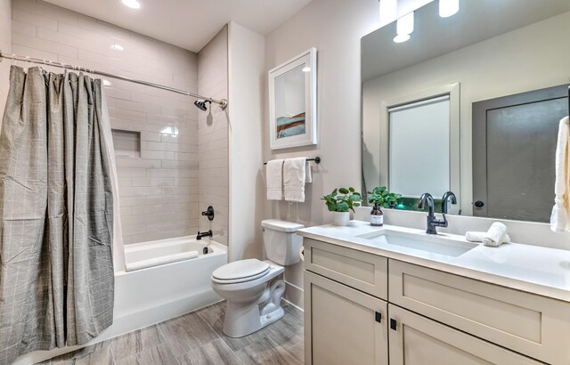 1108 Greenwood Ave, Nashville, TN 37206 - full bath featuring shower / tub combo with curtain, vanity, toilet, wood finished floors, and baseboards