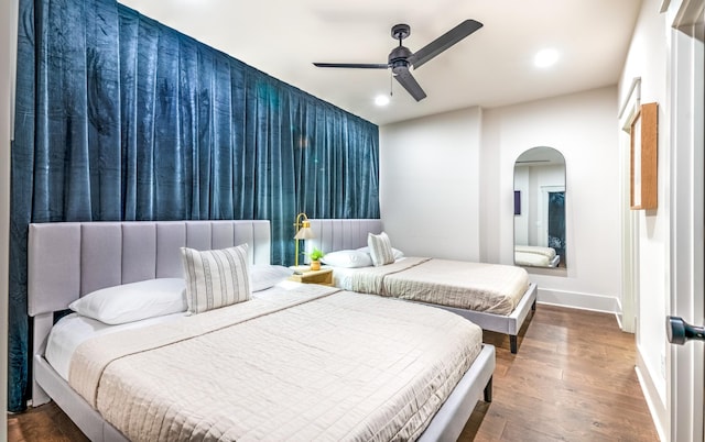 1108 Greenwood Ave, Nashville, TN 37206 - bedroom featuring arched walkways, baseboards, wood finished floors, recessed lighting, and ceiling fan