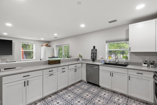 176 S Palmers Chapel Rd, White House, TN 37188 - kitchen featuring dishwasher, a sink, healthy amount of natural light, recessed lighting, and white cabinets