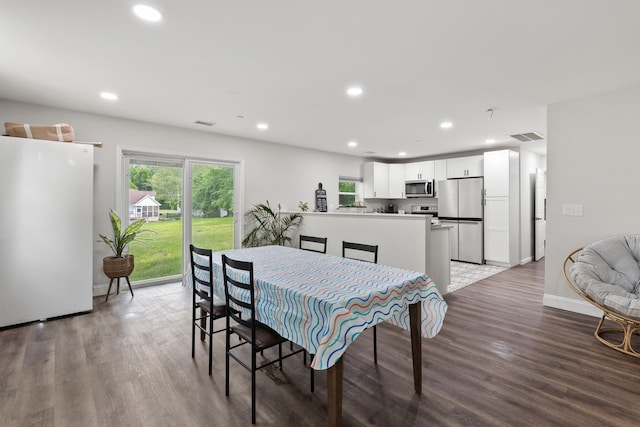 176 S Palmers Chapel Rd, White House, TN 37188 - dining room featuring recessed lighting, wood finished floors, and baseboards
