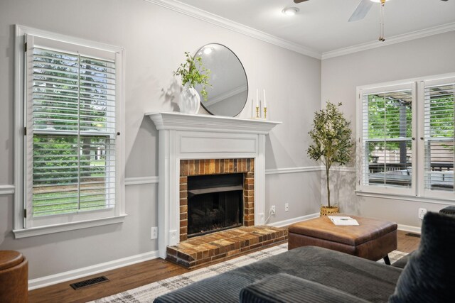 2723 Nottingham Ct, Thompsons Station, TN 37179 - living room featuring wood finished floors, a ceiling fan, ornamental molding, a brick fireplace, and baseboards