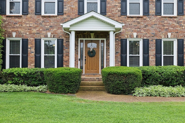 2723 Nottingham Ct, Thompsons Station, TN 37179 - doorway to property featuring a lawn and brick siding
