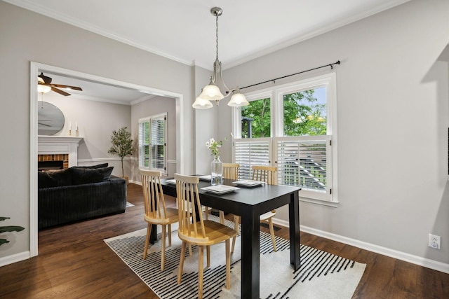 2723 Nottingham Ct, Thompsons Station, TN 37179 - dining room featuring crown molding, wood finished floors, ceiling fan, baseboards, and a fireplace