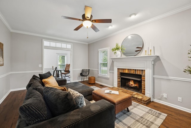 2723 Nottingham Ct, Thompsons Station, TN 37179 - living room featuring a fireplace, a ceiling fan, baseboards, wood finished floors, and crown molding