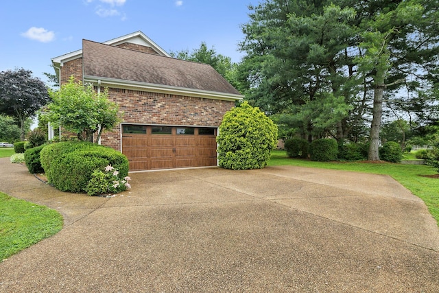2723 Nottingham Ct, Thompsons Station, TN 37179 - view of home's exterior featuring brick siding, driveway, and roof with shingles