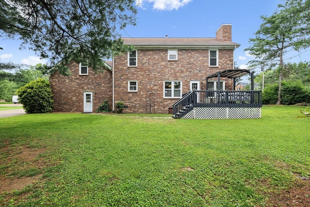 2723 Nottingham Ct, Thompsons Station, TN 37179 - back of property with a deck, a chimney, a pergola, a lawn, and brick siding