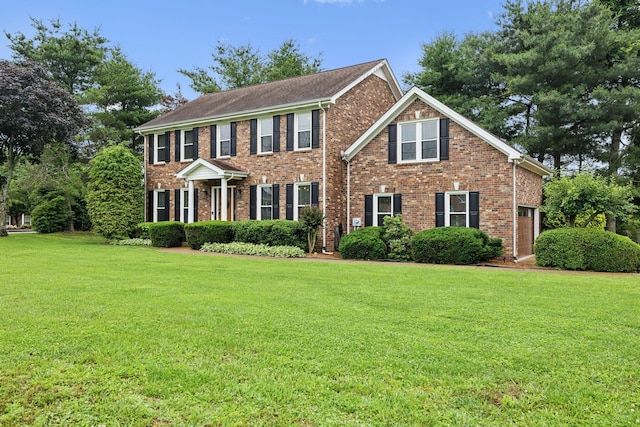 2723 Nottingham Ct, Thompsons Station, TN 37179 - colonial house featuring brick siding and a front lawn