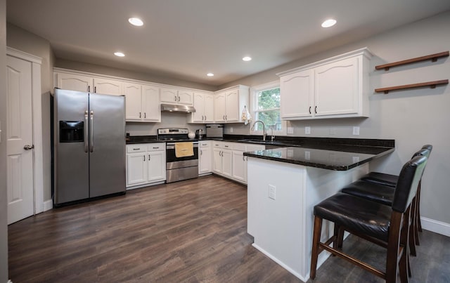1711 Bridget Dr, Murfreesboro, TN 37129 - kitchen with appliances with stainless steel finishes, a peninsula, open shelves, white cabinetry, and recessed lighting