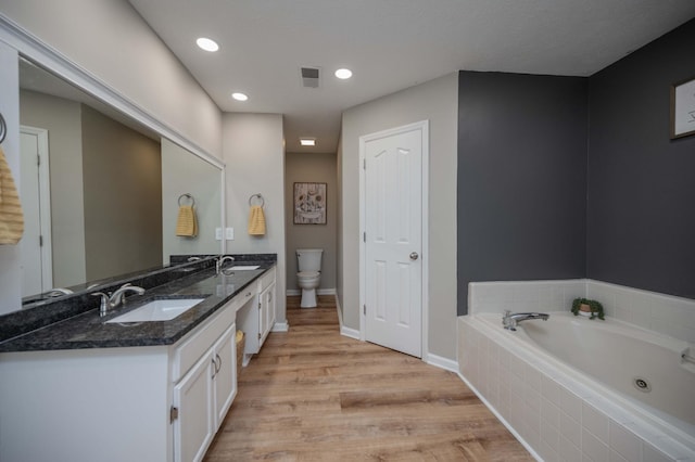 1711 Bridget Dr, Murfreesboro, TN 37129 - full bath featuring double vanity, a tub with jets, wood finished floors, and recessed lighting