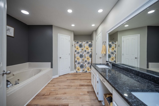 1711 Bridget Dr, Murfreesboro, TN 37129 - full bath featuring double vanity, wood finished floors, a garden tub, recessed lighting, and a shower with curtain