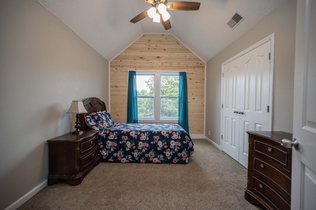 1711 Bridget Dr, Murfreesboro, TN 37129 - carpeted bedroom with wood walls, vaulted ceiling, ceiling fan, and a closet