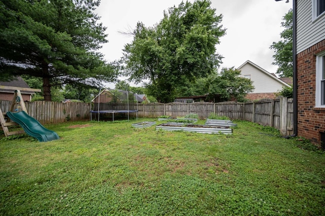 1711 Bridget Dr, Murfreesboro, TN 37129 - fenced backyard featuring a trampoline, a vegetable garden, and a playground