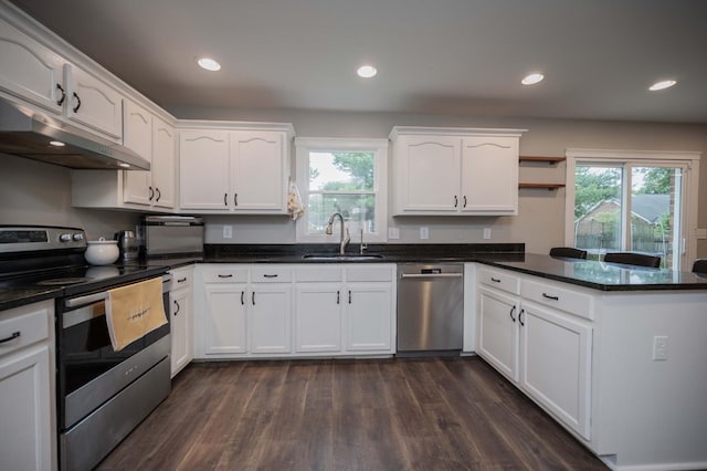 1711 Bridget Dr, Murfreesboro, TN 37129 - kitchen featuring stainless steel appliances, under cabinet range hood, a peninsula, white cabinetry, and recessed lighting