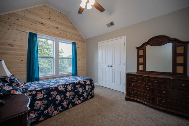 1711 Bridget Dr, Murfreesboro, TN 37129 - carpeted bedroom featuring wooden walls, vaulted ceiling, a ceiling fan, and a closet