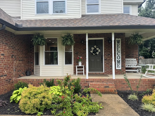 1711 Bridget Dr, Murfreesboro, TN 37129 - entrance to property featuring covered porch, roof with shingles, and brick siding
