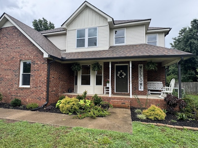 1711 Bridget Dr, Murfreesboro, TN 37129 - view of front facade with covered porch, brick siding, and a shingled roof