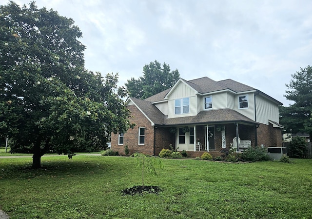 1711 Bridget Dr, Murfreesboro, TN 37129 - traditional-style home with brick siding, a porch, a front yard, and board and batten siding