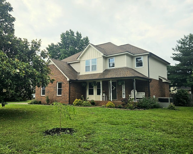 1711 Bridget Dr, Murfreesboro, TN 37129 - view of front of home featuring brick siding, a porch, a front yard, and board and batten siding