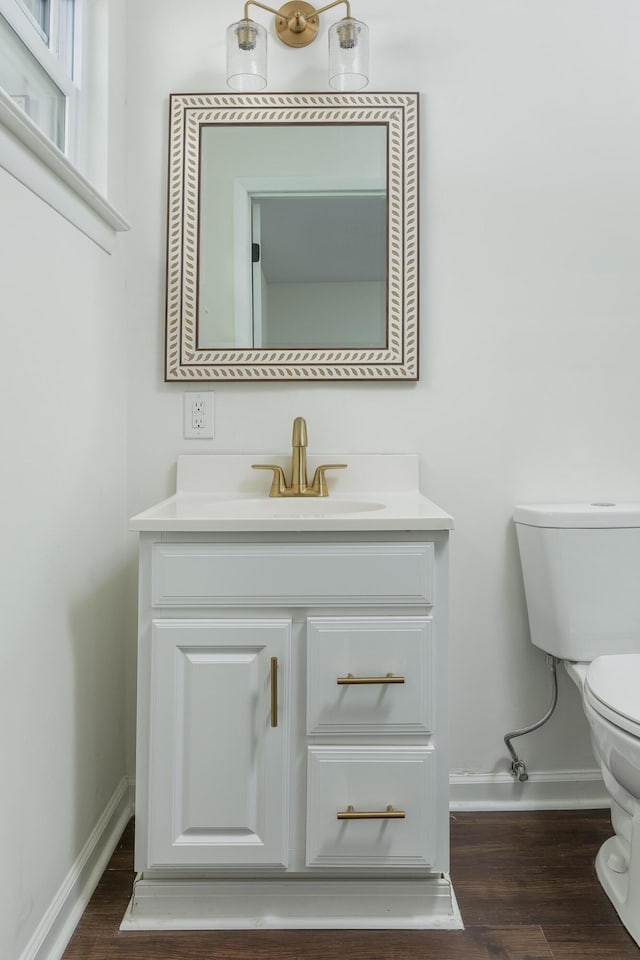 1313 W 46th St, Chattanooga, TN 37409 - bathroom with toilet, baseboards, vanity, and wood finished floors