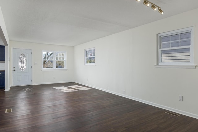 1313 W 46th St, Chattanooga, TN 37409 - entryway with dark wood finished floors, baseboards, and rail lighting