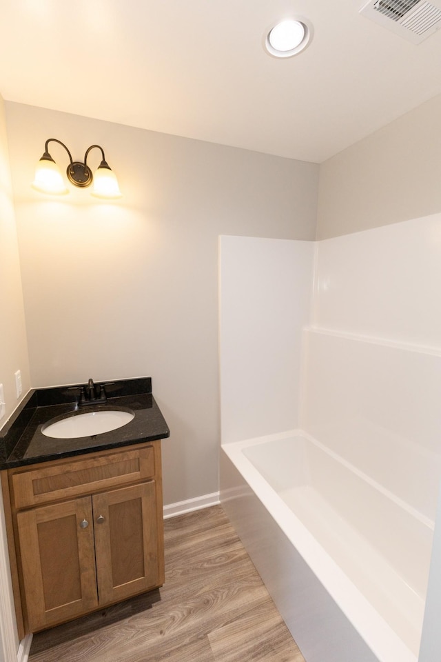 130 Mazie Dr, Lafayette, TN 37083 - bathroom with wood finished floors, vanity, and baseboards
