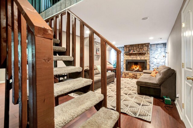 1203 Kingston Springs Rd, Kingston Springs, TN 37082 - living area featuring wood finished floors, a fireplace, recessed lighting, and stairs