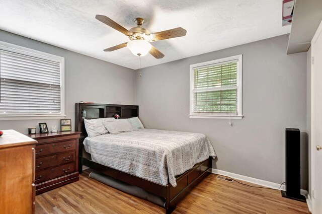 1203 Kingston Springs Rd, Kingston Springs, TN 37082 - bedroom with light wood finished floors, baseboards, and ceiling fan