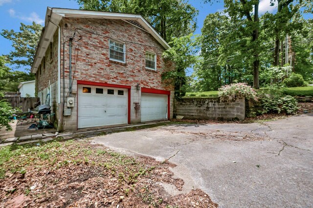1203 Kingston Springs Rd, Kingston Springs, TN 37082 - garage featuring concrete driveway