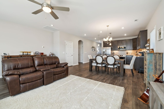 4913 Turquoise Ln, Murfreesboro, TN 37129 - living room with arched walkways, dark wood-style floors, ceiling fan, recessed lighting, and a chandelier