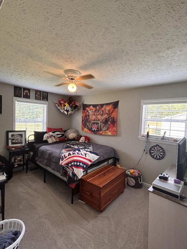1040 Rebecca Dr, Burns, TN 37029 - bedroom with carpet flooring, a textured ceiling, multiple windows, and ceiling fan