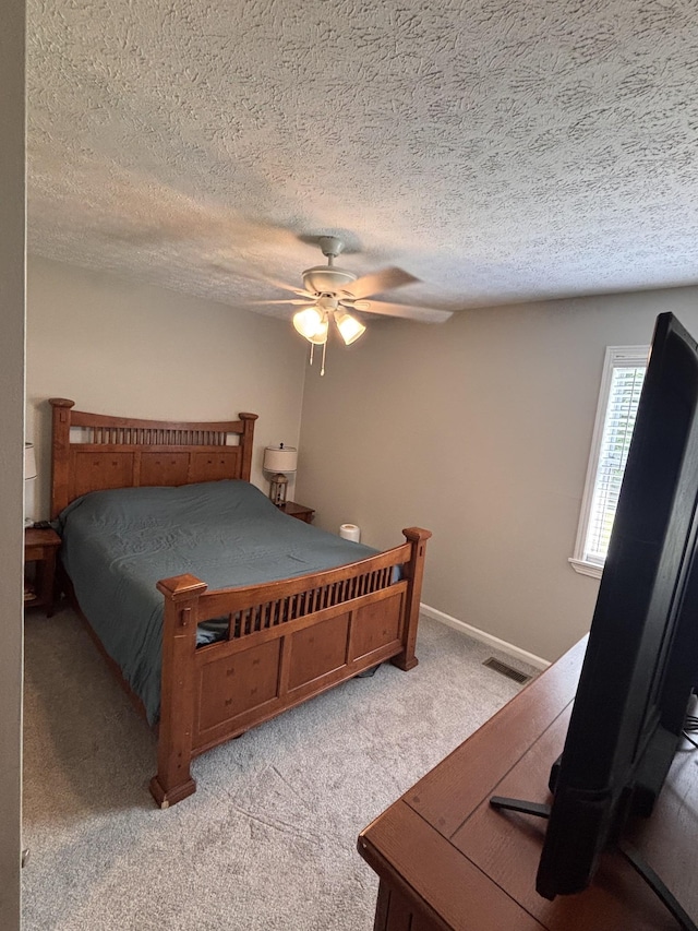 1040 Rebecca Dr, Burns, TN 37029 - bedroom featuring light colored carpet, ceiling fan, and a textured ceiling