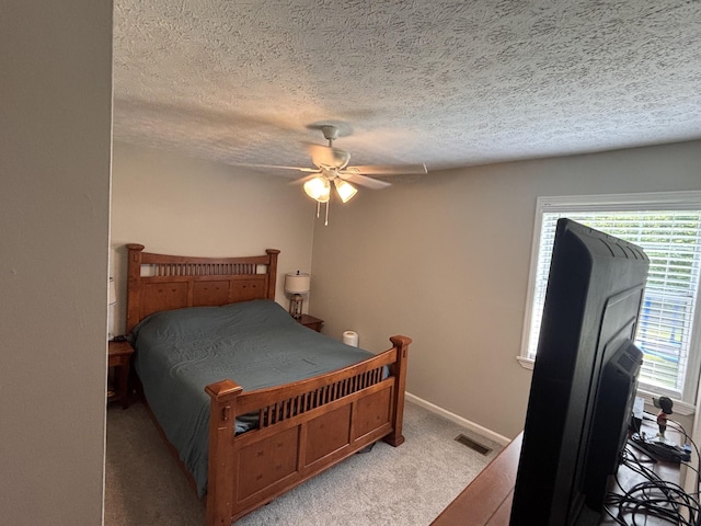 1040 Rebecca Dr, Burns, TN 37029 - bedroom featuring light carpet, a textured ceiling, ceiling fan, and baseboards