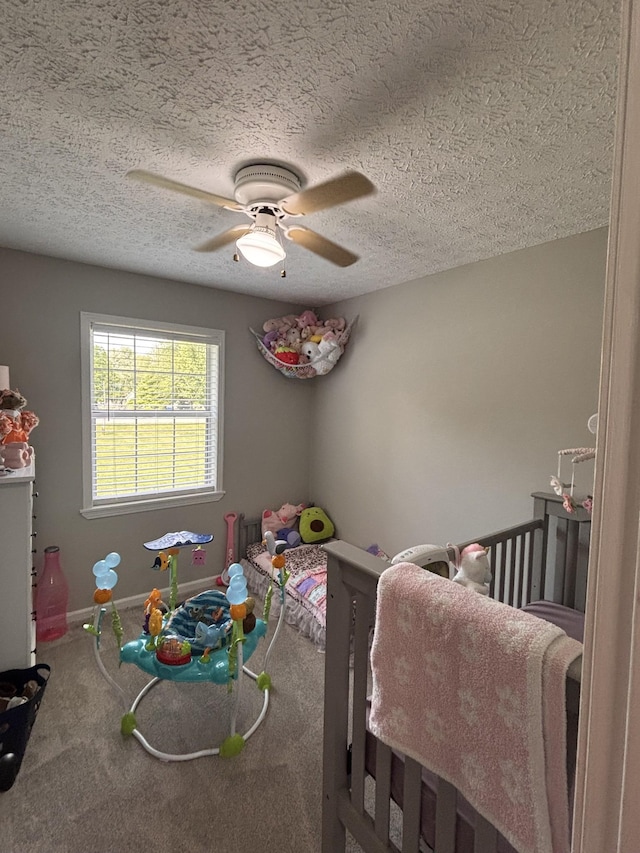 1040 Rebecca Dr, Burns, TN 37029 - carpeted bedroom featuring a textured ceiling, ceiling fan, and baseboards