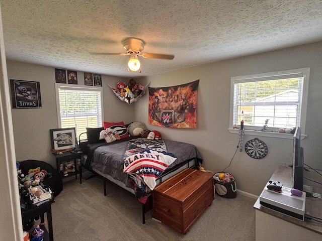 1040 Rebecca Dr, Burns, TN 37029 - bedroom featuring carpet flooring, multiple windows, a textured ceiling, and a ceiling fan