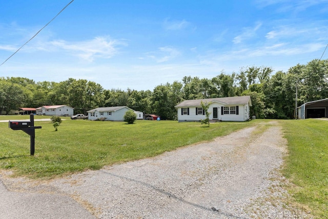 1040 Rebecca Dr, Burns, TN 37029 - single story home featuring driveway, a front yard, and view of wooded area