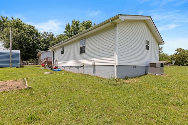 1040 Rebecca Dr, Burns, TN 37029 - view of side of property with cooling unit, crawl space, and a lawn